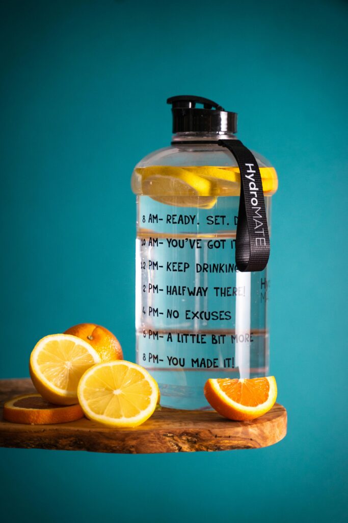 ''bottle of lemon water showing hydration and wellness habits”