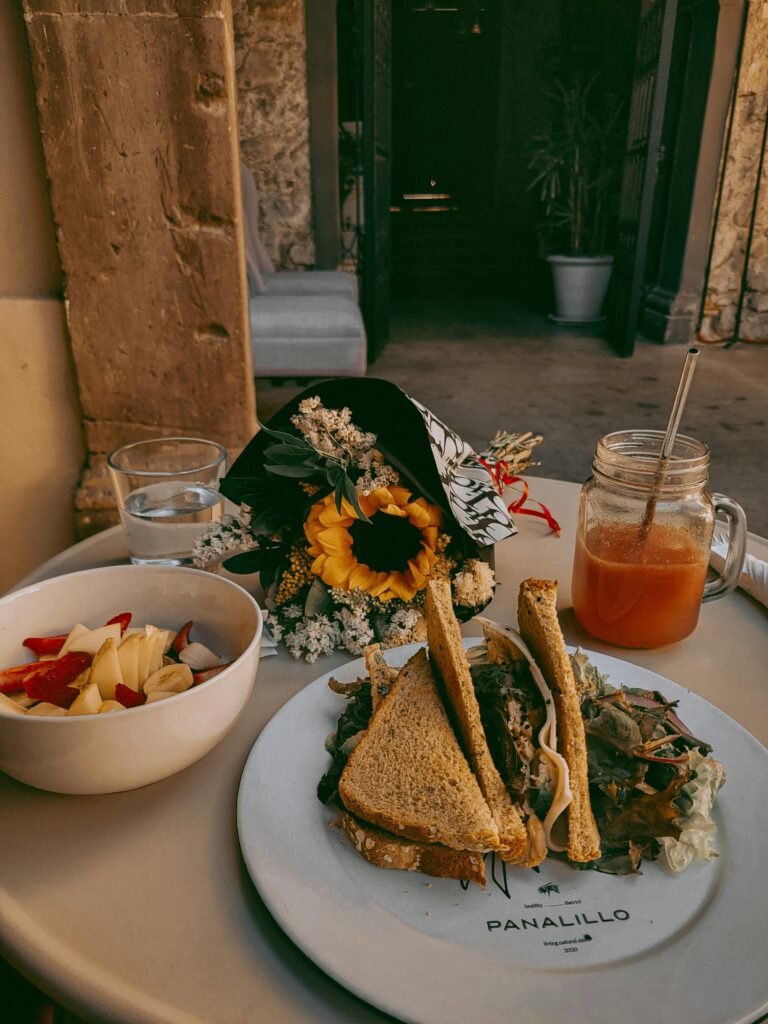 travel-friendly vegan breakfast setup with smoothie bowl and travel essentials