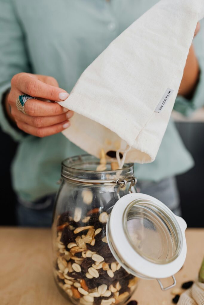 Assorted nuts and dried fruits in a bowl — perfect non-perishable travel snacks.